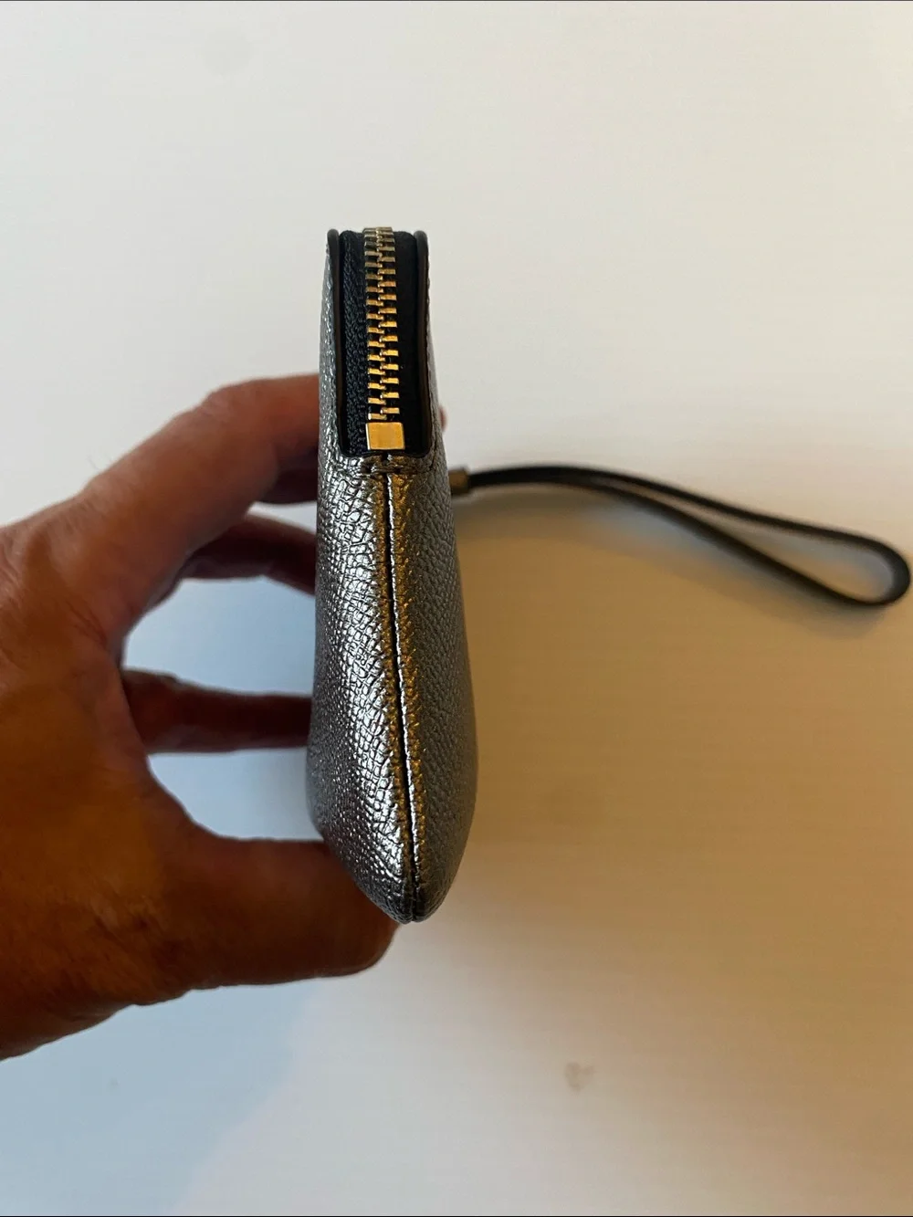 Coach Corner Zip Leather Wristlet in Silver and Black. F21070